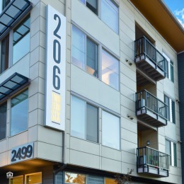 If you're looking for a modern and pet-friendly home with amazing community amenities in Hillsboro, look no further than 206 Apartments. exterior of 206 Apartments with windows and balconies