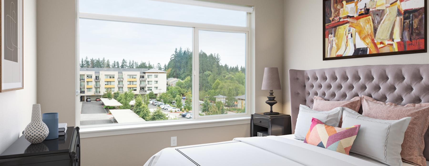 a bedroom with a large window