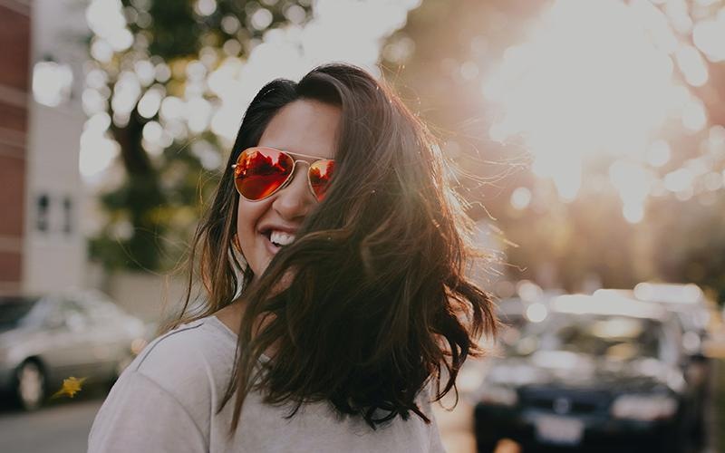 Find your perfect fit at 206 Apartments a woman wearing sunglasses